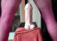 Sissy squirts piss through her cock cage while stretching her anal pussy with big toys